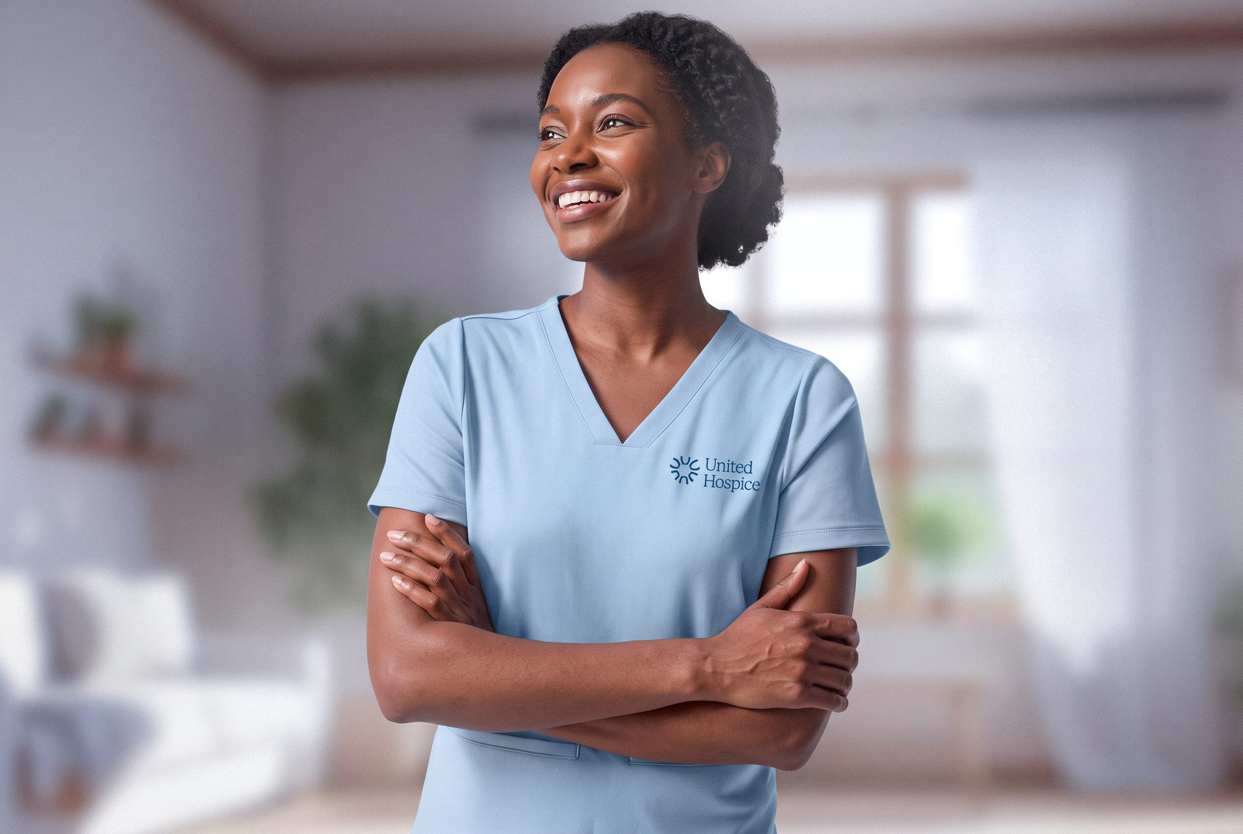A United Hospice nurse in uniform, smiling